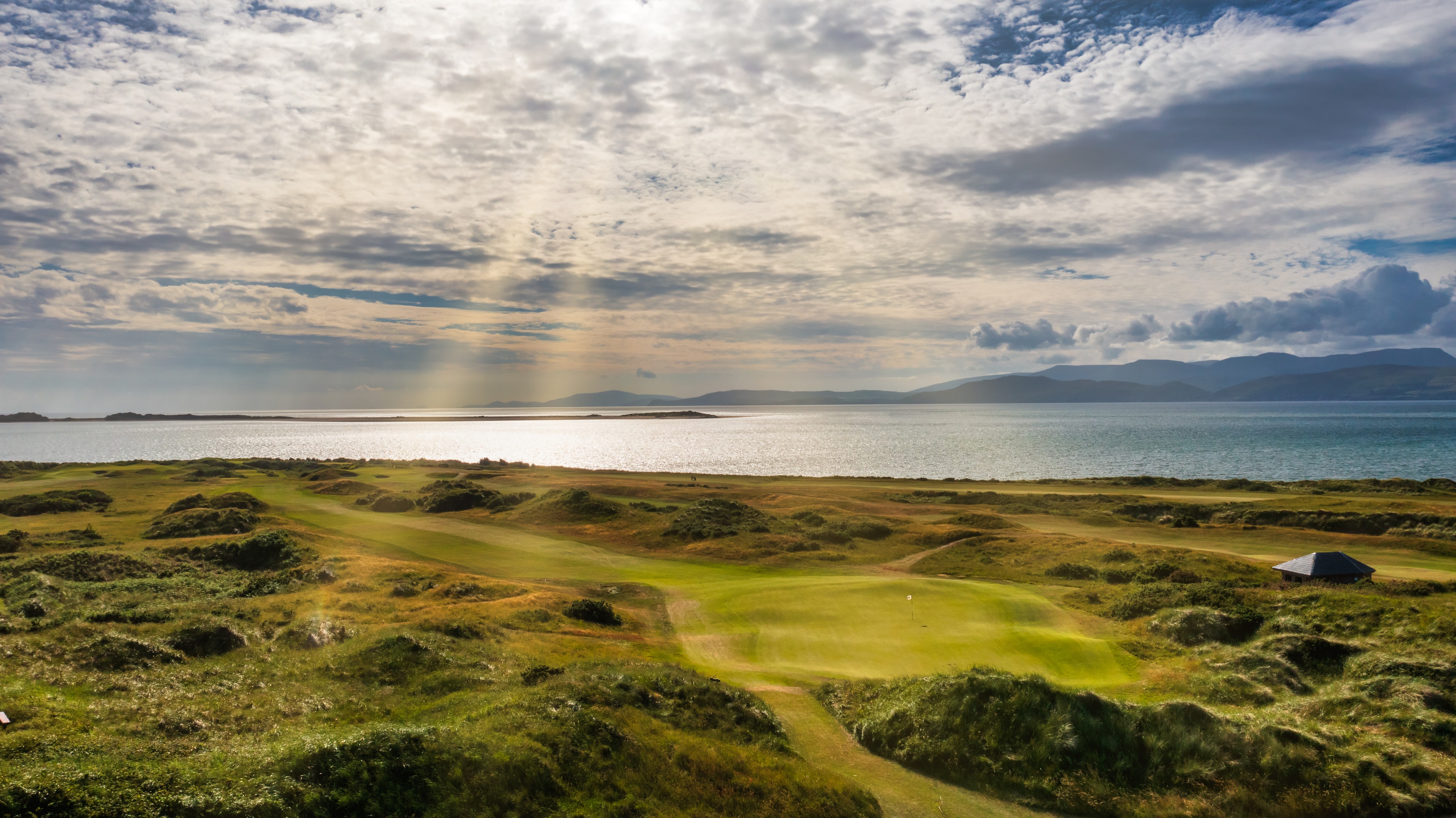 Dooks Golf Club on the southern shore of Dingle Bay with the Kerry mountains beyond
