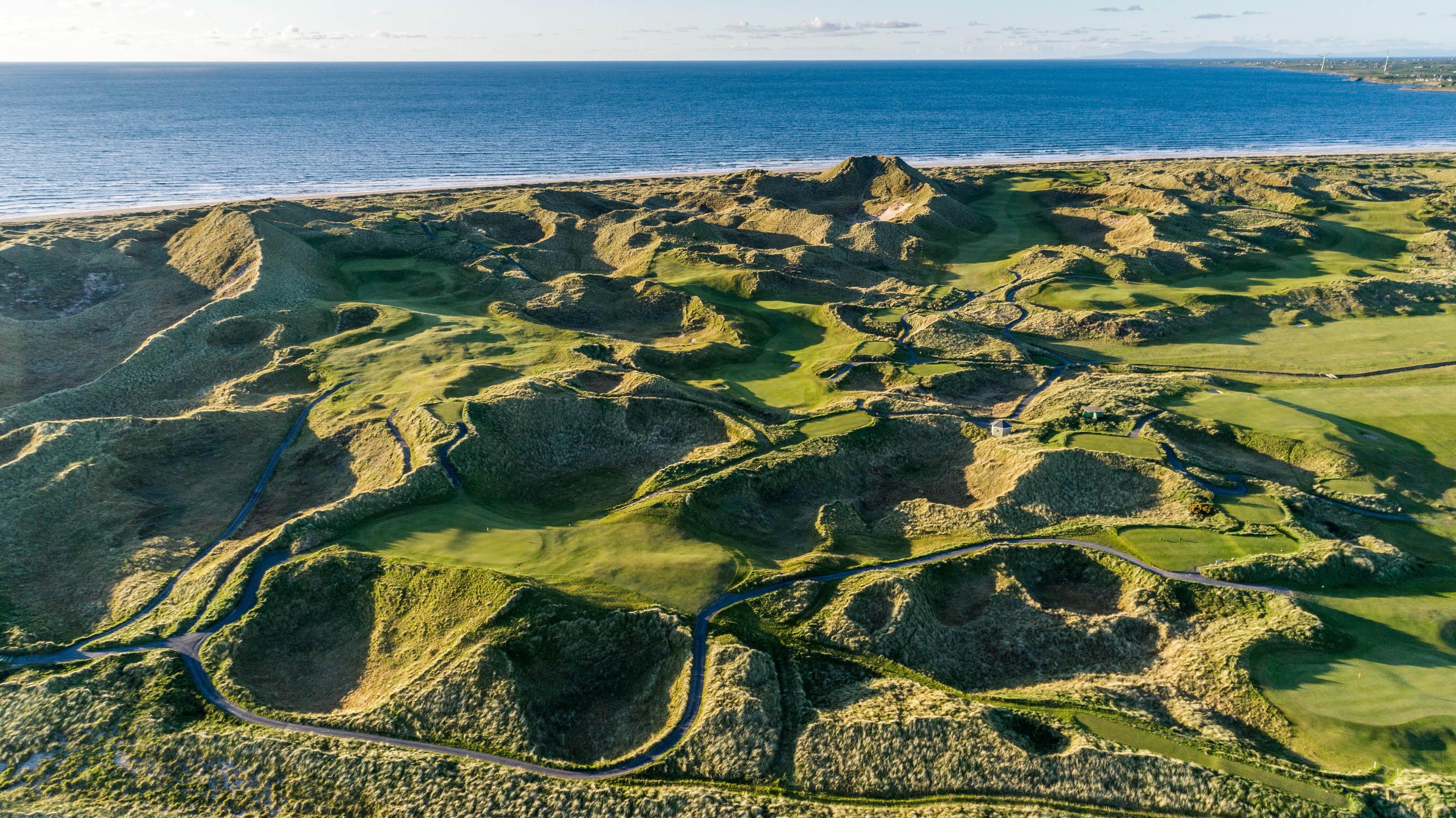 Aerial view of Enniscrone Golf Club with Killala Bay and the Sligo coastline beyond