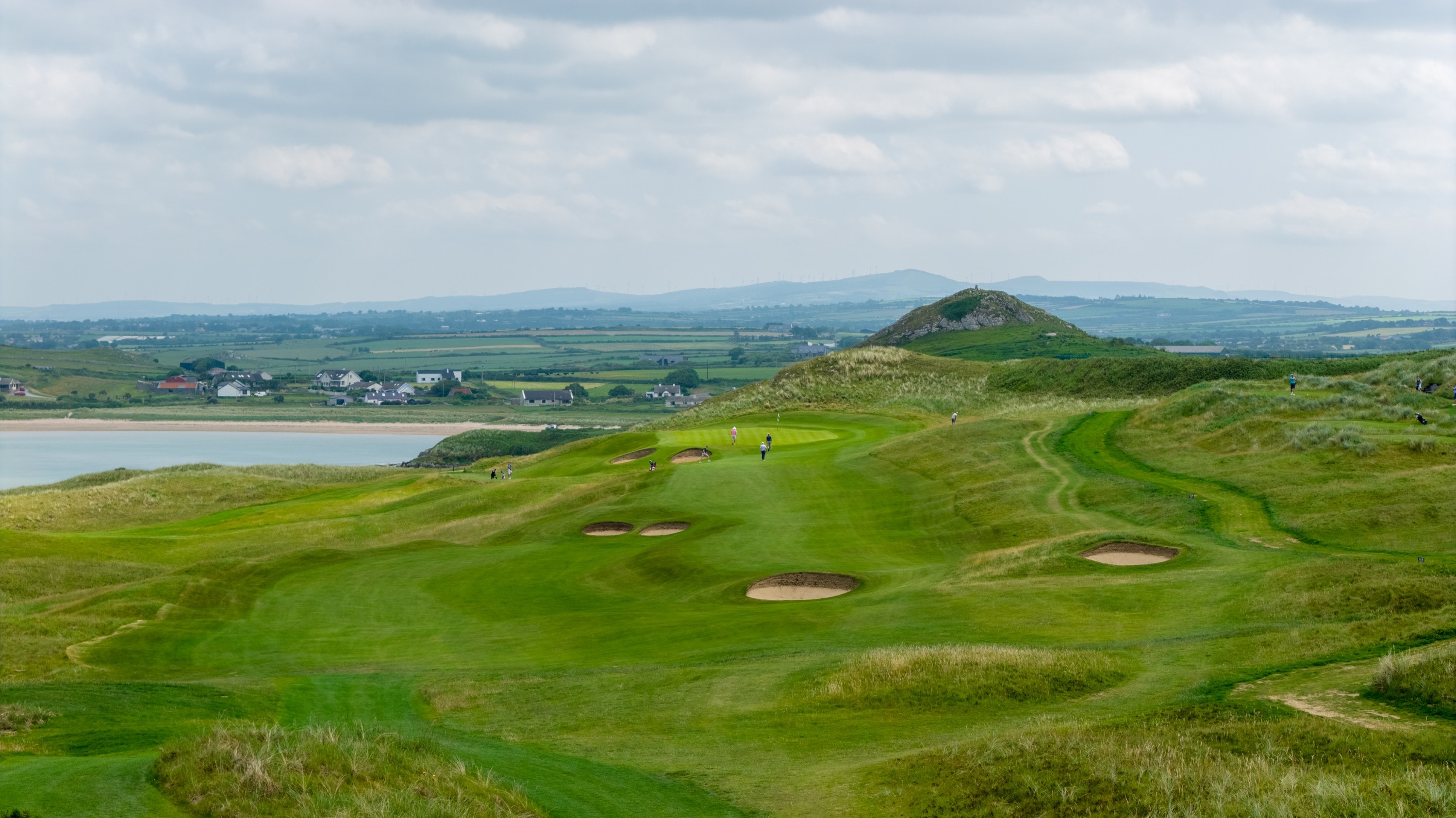 14th hole at Tralee Golf Club with Tralee Bay and the mountains beyond