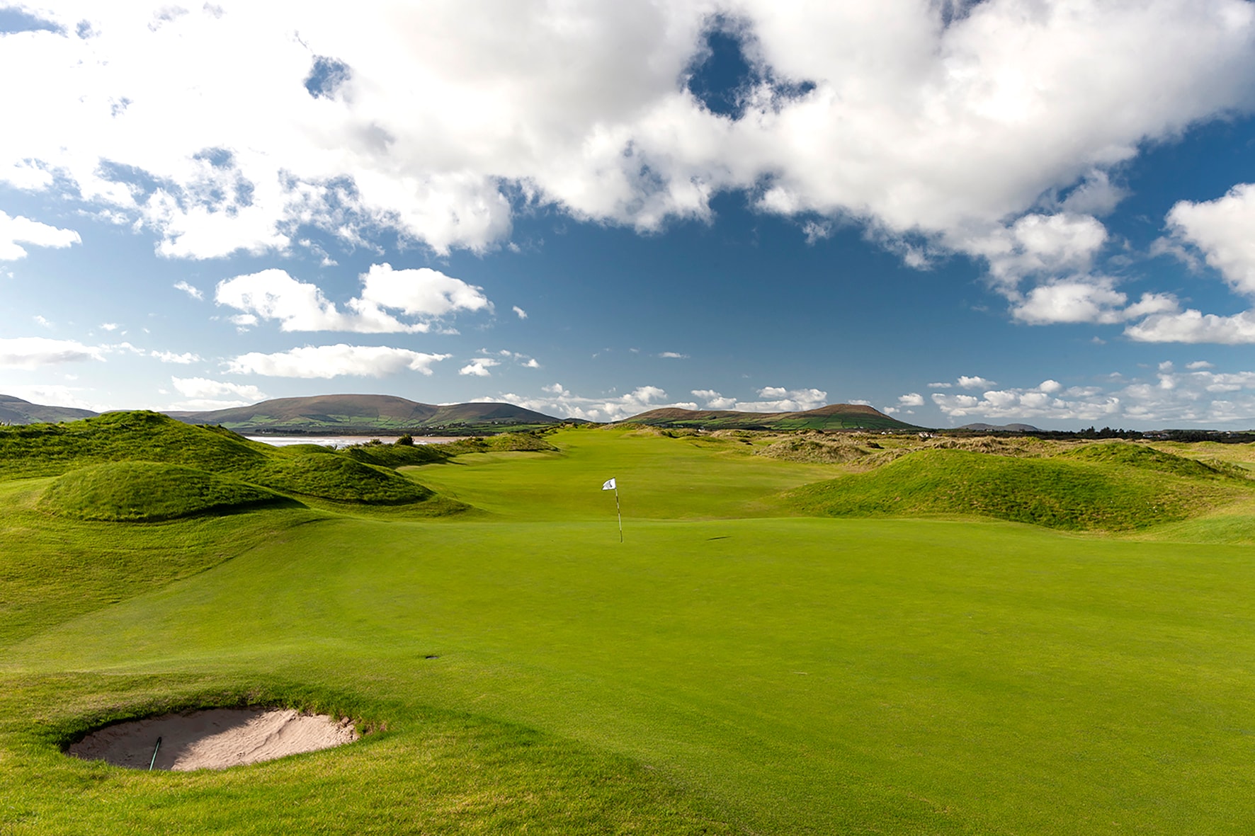 The 18th green at Waterville with Dingle Bay estuary beyond